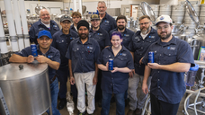 Teaching Brewery staff and a group of third semester students from the Brewmaster and Brewery Operations Management program (who contributed to making the award-winning brew) pose with cans of NC Craft Bitter at the Teaching Brewery following its latest gold-medal win. Front row (from left) Hector Hernandez, Harjit Jaura, Blake Hunt, and Mitchel Clucas. Back row (from left): Jon Downing (Brewmaster Professor), Sungyeon Kim, Dylan Webster, June Amey, Calvin Arnt, Ian Morrison (Head Brewery), and Adam Marshall (Lead Brewer).